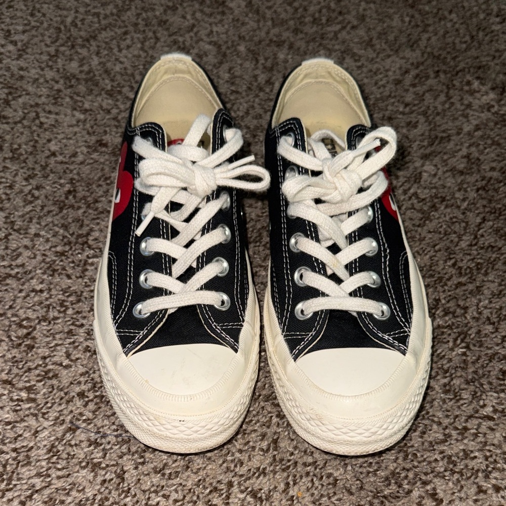 Converse comme des Garcons Black and White Sneakers with Red Accent.